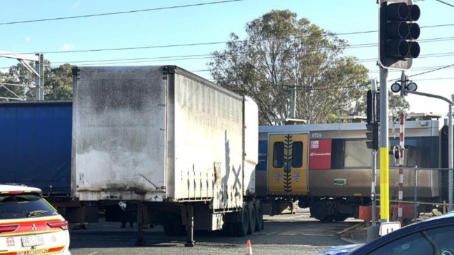Traffic Chaos As Truck And Train Crash In Australia second image