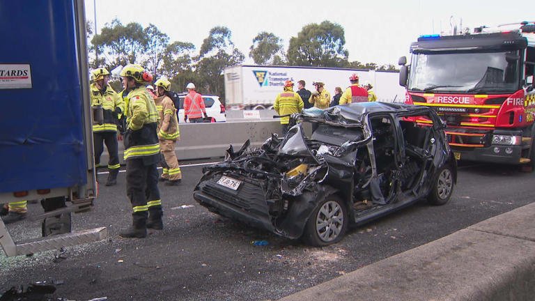 Woman ‘Sandwiched’ Between A Trailer And A Car