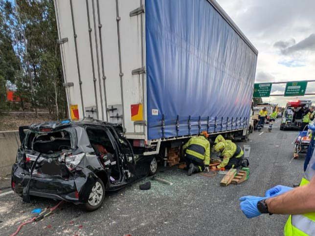 Woman 'sendwiched' Between A Trailer And A Car second image