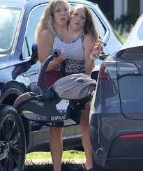 Conjoined Twins Break Silence After Photos Of Them Holding A Newborn second image