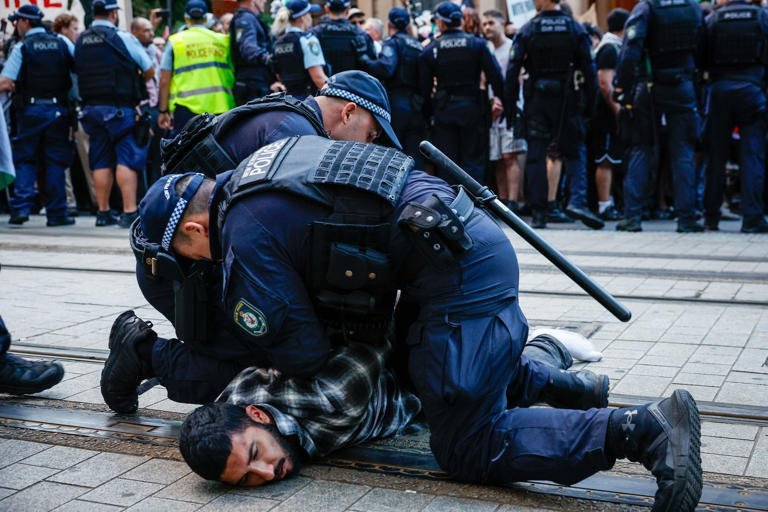 Protest Pandemonium Erupts 418 Arrests Spark National Outrage - Second Image