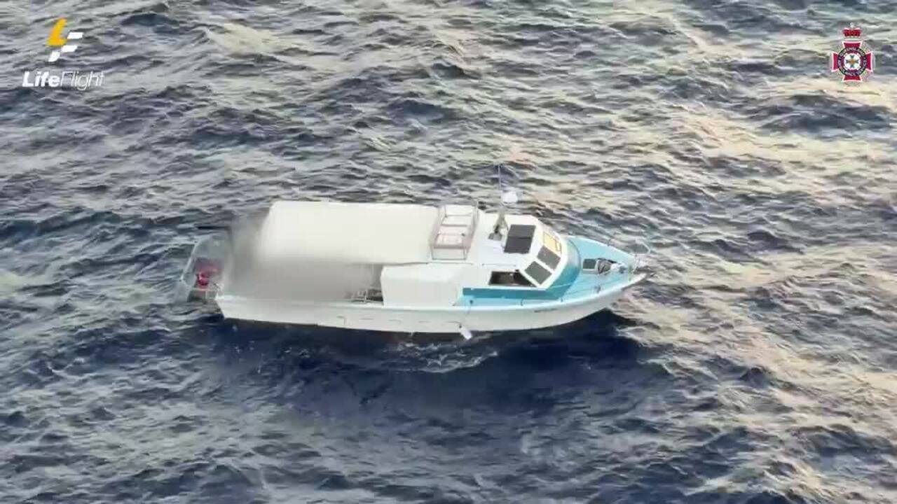 "FIVE MATES' DESPERATE 10-HOUR BATTLE TO STAY AFLOAT ON DYING BOAT OFF GOLD COAST" - Second Image