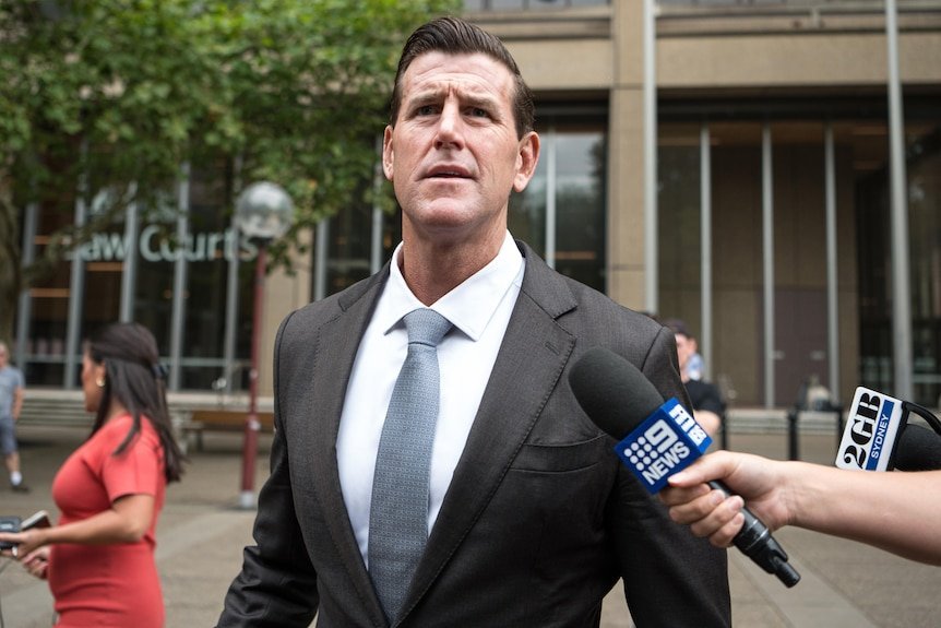  War Hero's Shocking Fall Decorated Soldier Faces War Crimes Trial - Second Image
